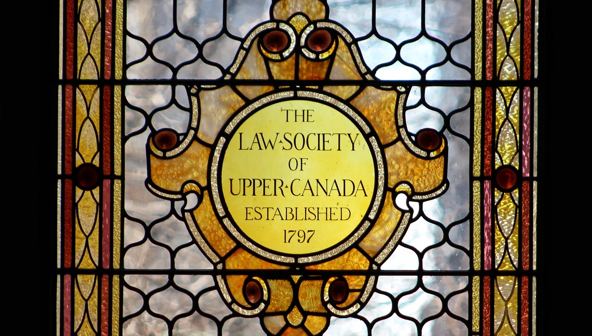 Stained glass window with text Law Society of Upper Canada established 1797
