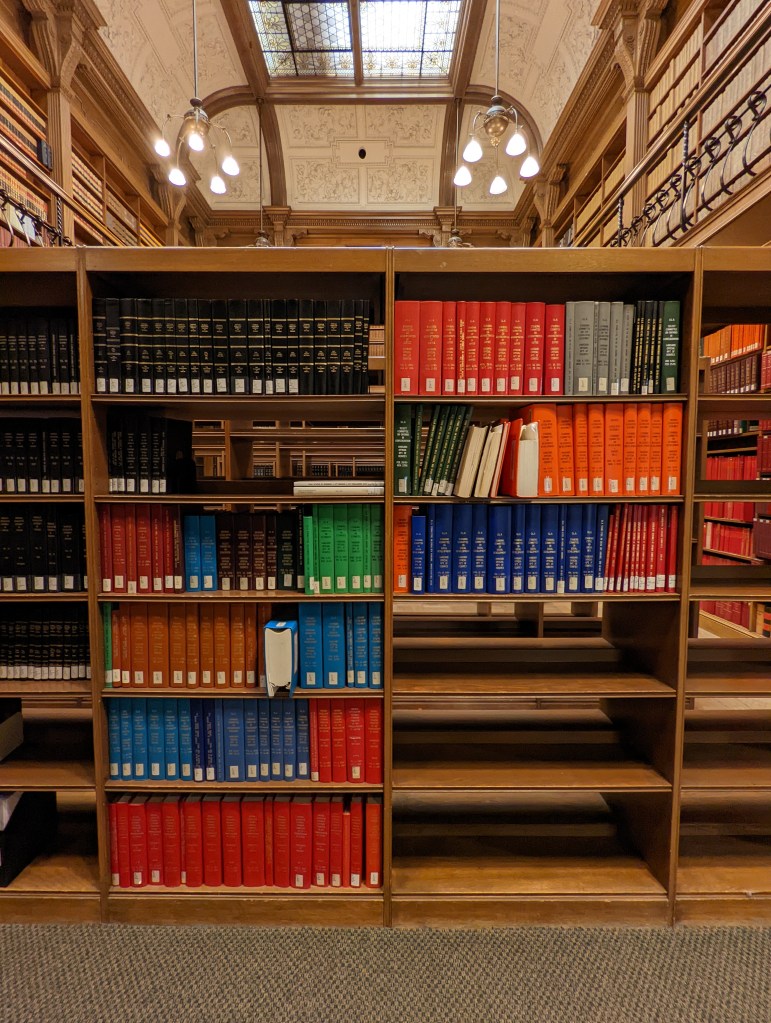 Printed and bound Ontario Committee Hansard materials on a shelf in the Great Library’s American room.